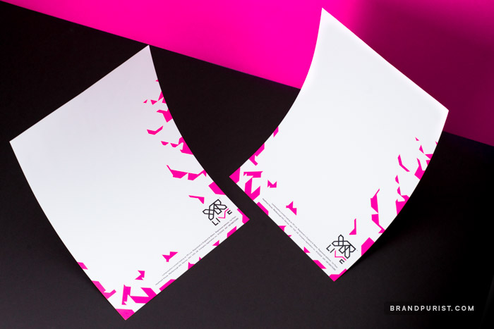 YR Live letterheads designed with typographic elements and hot pink shard pattern along the right and bottom edges.