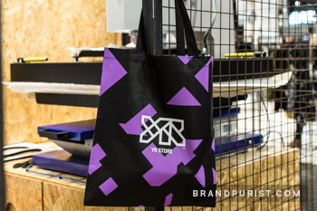 Tote bag with YR Store logo and signature purple shard graphics.