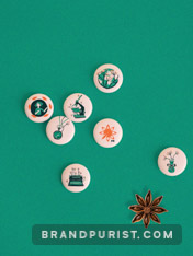Pins featuring Aniseed PR branded illustrations.