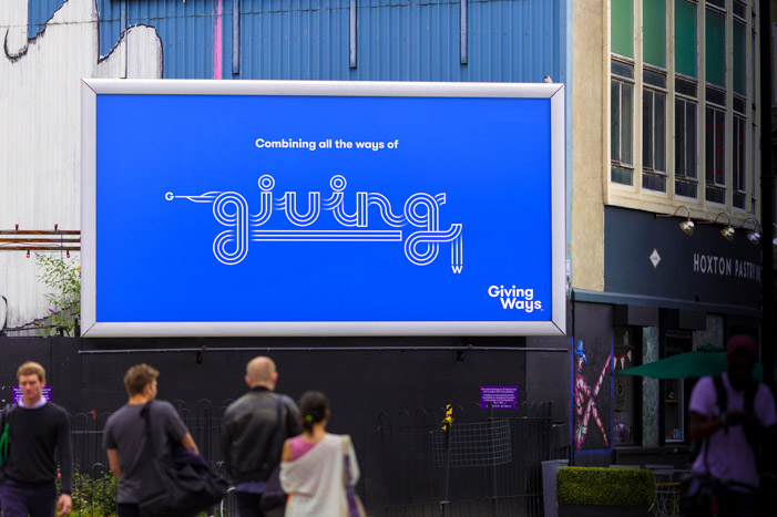 Advertising billboard for GivingWays with white type design of the word 'giving' on blue background.