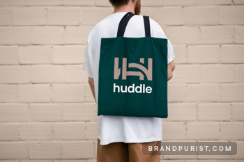 Huddle’s logo shown on a photo of a tote bag.