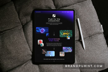 One Small Pixel website homepage with ‘Push for the unexpected’ and ‘Experiences that move’ slogans displayed on a tablet.