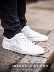 Close-up photo of men’s trainer in white shot for the URTA lookbook in Shoreditch, London.