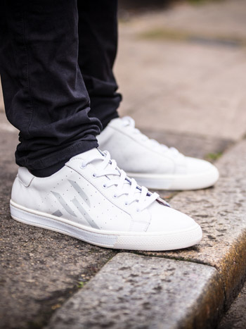 Close-up photo of  mens trainer in white shot for the URTA lookbook in Shoreditch, London.