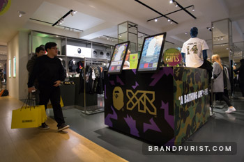 Visitors approaching the YR x BAPE customisation booth at Selfridges, Oxford Street.