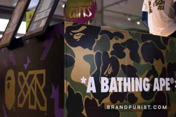 Detailed view of co-branding vinyl featuring YR Store and BAPE brand designs at Selfridges.