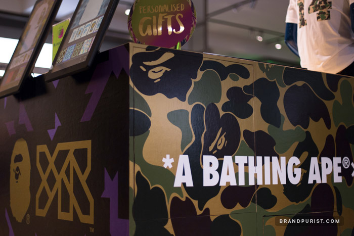 Close-up of the co-branding vinyl designs with one side focused on YR Store and another on BAPE brand expressions.