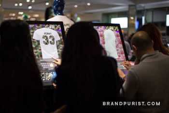 Customers using YR Store’s design software to create personalised BAPE t-shirts at Selfridges.
