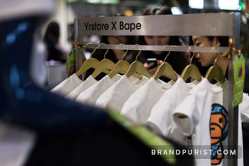 Customers browsing BAPE t-shirts from the YR Store collaboration at Selfridges.
