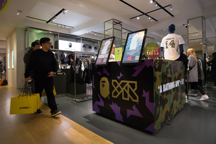 Visitors approaching the YR x BAPE booth in the Selfridges store.