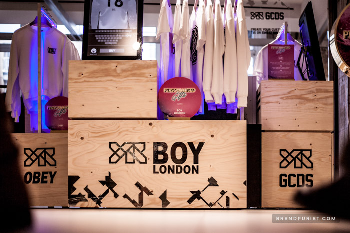 In-store retail installation featuring YR, Obey, Boy London and GCDS logos.