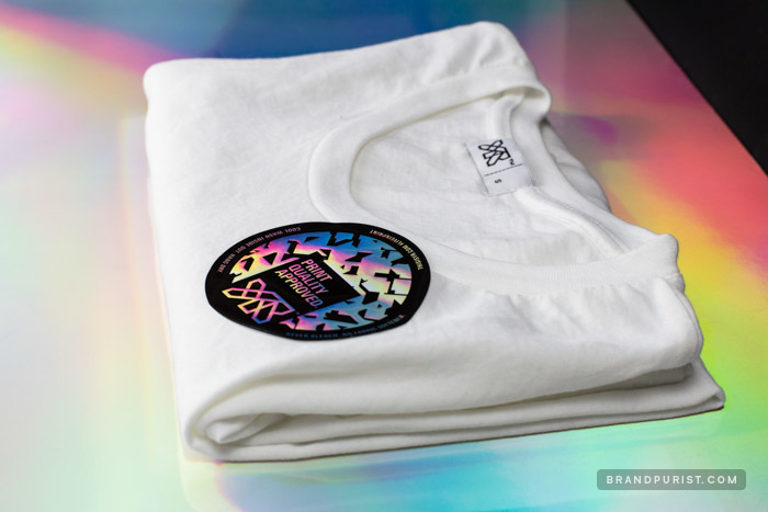 Screen printed holographic foil sticker designed for YR to emphasise print quality on t-shirts and other garments.
