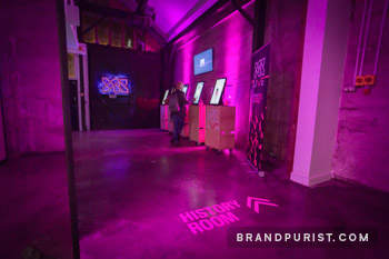 YR Live history room where past projects were showcased on large touch screens. 