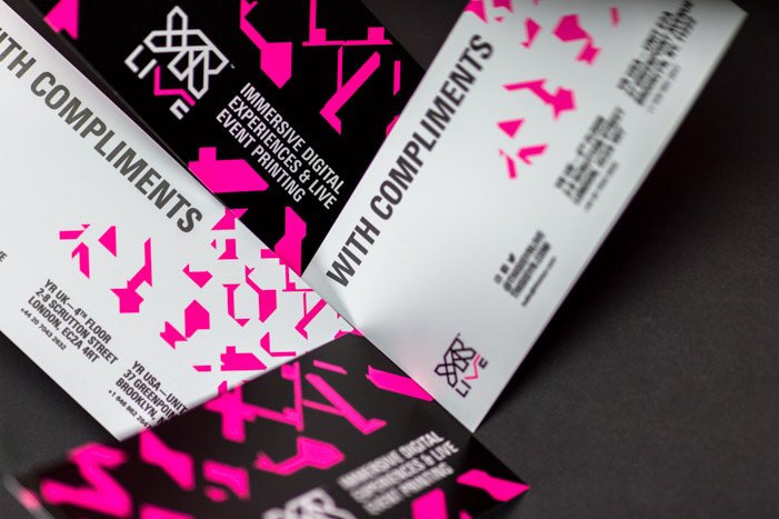 Close-up of screen printed YR Live comp slips with detailed hot pink shard patterns.