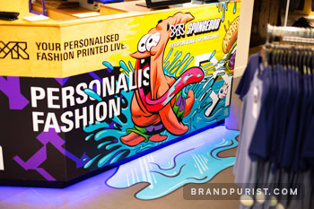 Close-up of YR Store counter vinyl wrap with Patrick Star and SpongeBob logo.