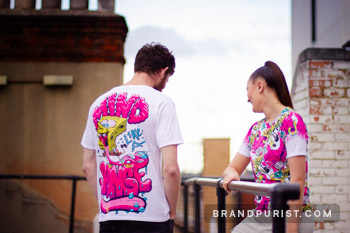 Lifestyle shot of YR Store t-shirts with 'Mind like a sponge' and SpongeBob spatula artwork on a rooftop in Shoreditch.