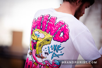 Close-up shot of 'Mind like a sponge' artwork on YR Store t-shirt.