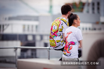 Lifestyle shot of 'Yellow is the color of happiness' and Patrick Star t-shirt on the rooftop.