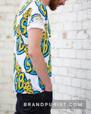 Side view product photo of the YR Store x SpongeBob t-shirt with all-over logo pattern.