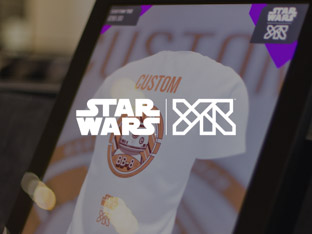 The Star Wars and YR logos overlaid on the photo of a large touchscreen displaying a custom Star Wars t-shirt. 